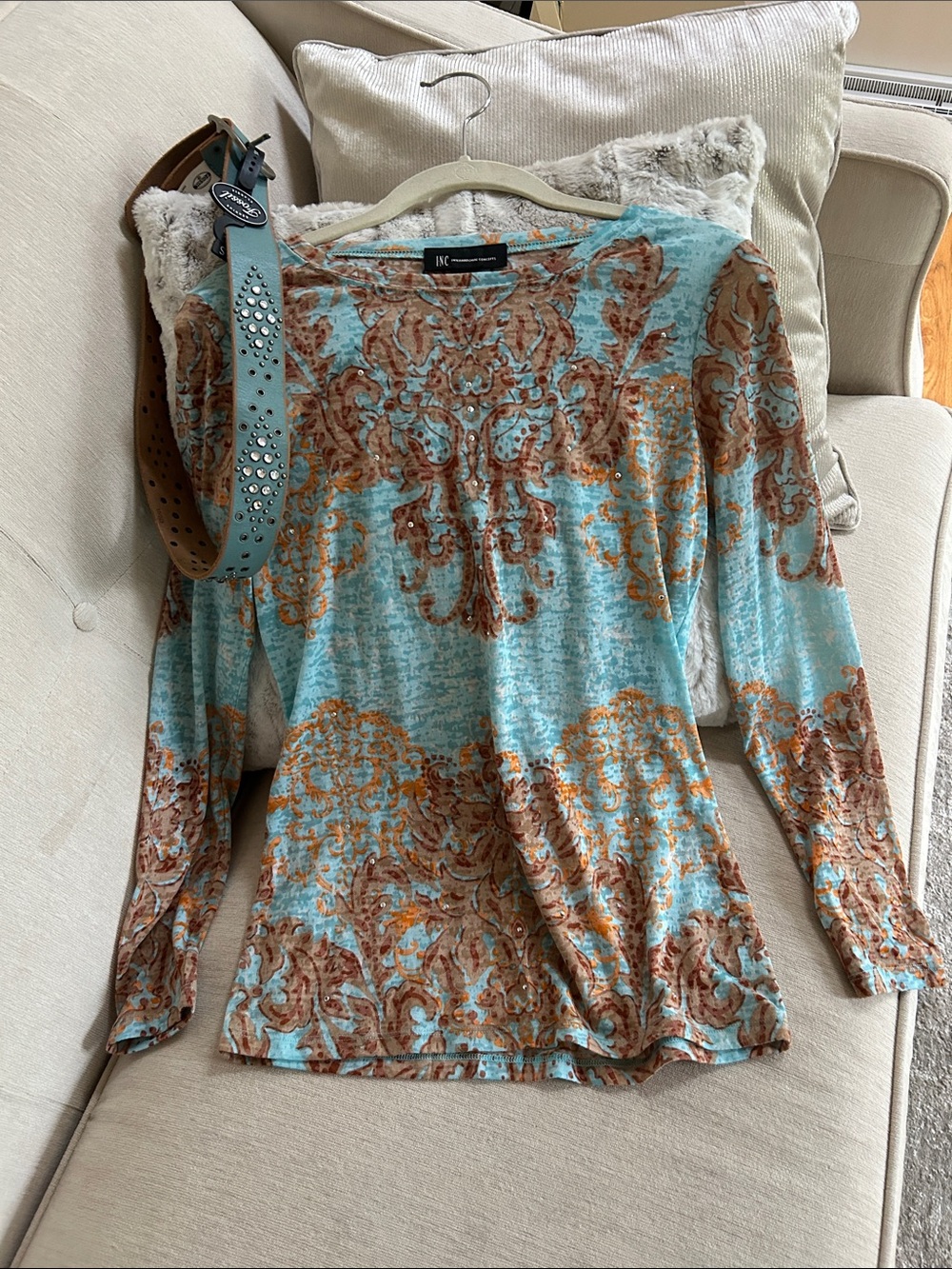 Fossil Blue studded belt and INC Orange Patterned Top with Studded detail